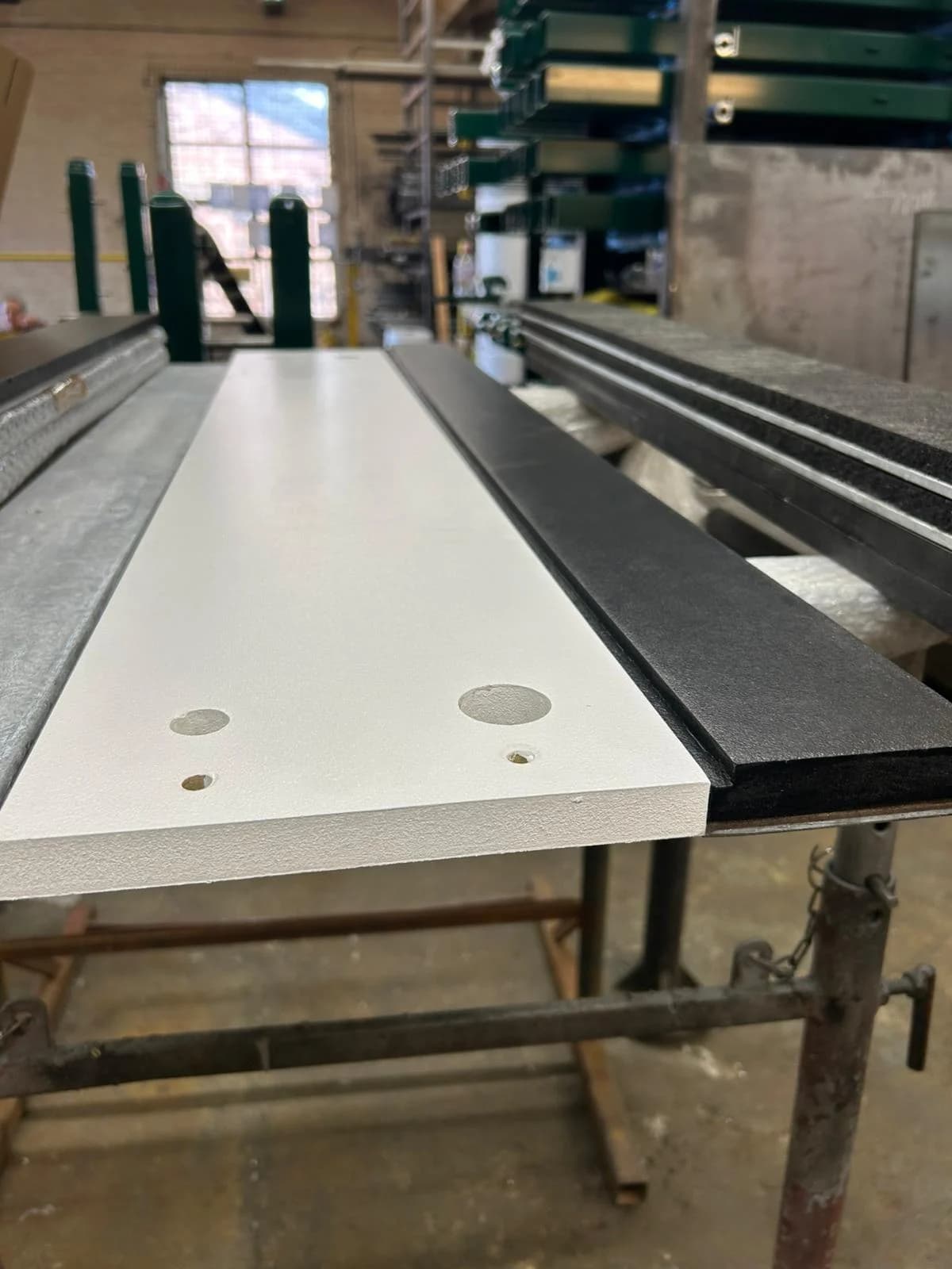 Cantabrian take off board with durable wood top with pre-drilled holes on reinforced galvanised steel frame and black rubber edge.